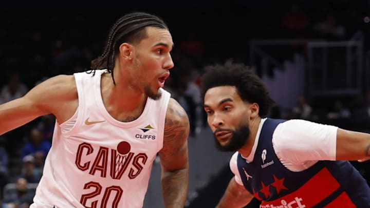 Cleveland Cavaliers guard Jaylon Tyson drives to the basket as Washington Wizards forward Justin Champagnie defends. Cleveland Cavaliers guard Jaylon Tyson drives to the basket as Washington Wizards forward Justin Champagnie defends.