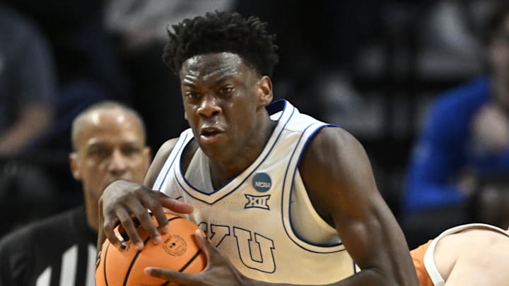 Mar 19, 2026; Portland, OR, USA; BYU Cougars forward AJ Dybantsa (3) keeps the ball from Texas Longhorns forward Camden Heide (5) in the second half during a first round game of the men's 2026 NCAA Tournament at Moda Center. Mandatory Credit: Craig Strobeck-Imagn Images