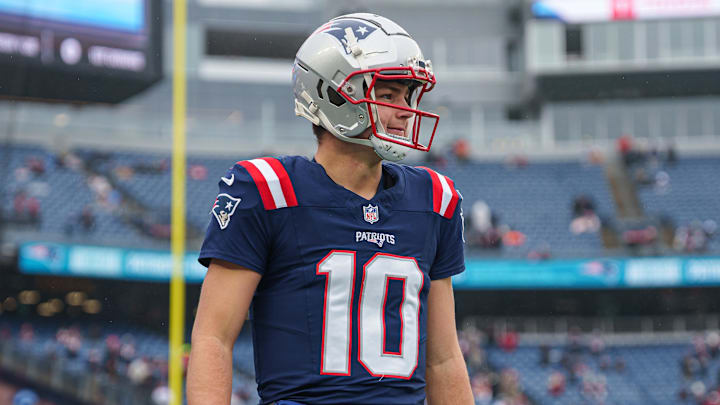 Dec 28, 2024; Foxborough, Massachusetts, USA; New England Patriots quarterback Drake Maye (10) warms up before the start of the game against the Los Angeles Chargers at Gillette Stadium. Mandatory Credit: David Butler II-Imagn Images