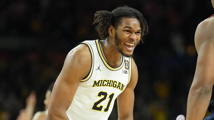 Apr 6, 2026; Indianapolis, IN, USA; Michigan Wolverines forward Morez Johnson Jr. (21) celebrates after defeating the Connecticut Huskies in the national championship of the Final Four of the men's 2026 NCAA Tournament at Lucas Oil Stadium. Mandatory Credit: Robert Deutsch-Imagn Images Apr 6, 2026; Indianapolis, IN, USA; Michigan Wolverines forward Morez Johnson Jr. (21) celebrates after defeating the Connecticut Huskies in the national championship of the Final Four of the men's 2026 NCAA Tournament at Lucas Oil Stadium. Mandatory Credit: Robert Deutsch-Imagn Images