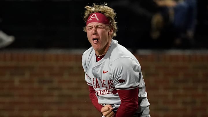 Arkansas left fielder Charles Davalan (24) reacts after he safely reached home against Vanderbilt on a double hit by Kuhio Aloy during the ninth inning at Hawkins Field in Nashville, Tenn.