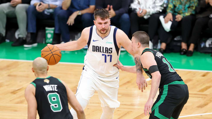 Jun 9, 2024; Boston, Massachusetts, USA; Dallas Mavericks guard Luka Doncic (77) dribbles the ball against Boston Celtics guard Payton Pritchard (11) during the fourth quarter in game two of the 2024 NBA Finals at TD Garden. Mandatory Credit: Peter Casey-USA TODAY Sports