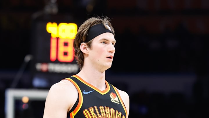 Dec 29, 2024; Oklahoma City, Oklahoma, USA; Oklahoma City Thunder center Branden Carlson (15) walks down the court during a time out against the Memphis Grizzlies during the fourth quarter at Paycom Center. Mandatory Credit: Alonzo Adams-Imagn Images