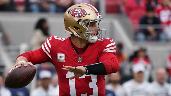 Nov 17, 2024; Santa Clara, California, USA; San Francisco 49ers quarterback Brock Purdy (13) throws a pass against the Seattle Seahawks in the second quarter at Levi's Stadium. Mandatory Credit: David Gonzales-Imagn Images