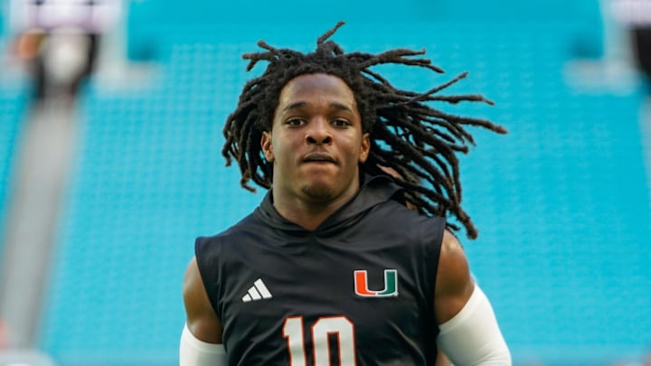 Nov 8, 2025; Miami Gardens, Florida, USA; Miami Hurricanes wide receiver Malachi Toney (10) warms up before a game against the Syracuse Orange at Hard Rock Stadium. Mandatory Credit: Jeff Romance-Imagn Images