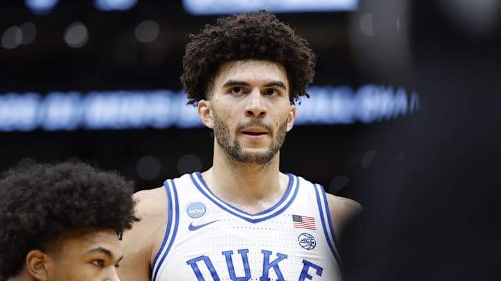 Duke Blue Devils forward Cameron Boozer (12) waits for the ball to be thrown into play as UConn Huskies forward Jaylin Stewart (3) defends in the first half during an Elite Eight game of the East Regional of the men's 2026 NCAA Tournament at Capital One Arena.