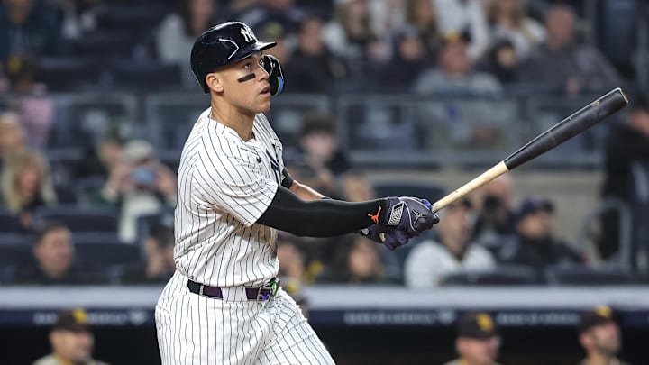May 6, 2025; Bronx, New York, USA;  New York Yankees right fielder Aaron Judge (99) hits a solo home run in the fourth inning against the San Diego Padres at Yankee Stadium.