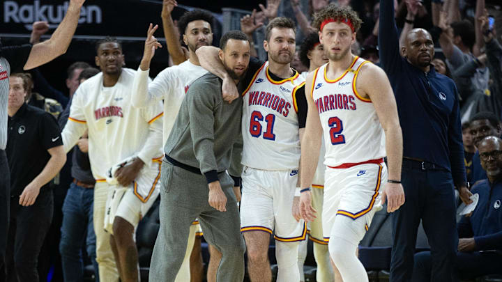 Mar 18, 2025; San Francisco, California, USA; The Golden State Warriors bench celebrates a 3-point basket against the Milwaukee Bucks during the fourth quarter at Chase Center. Mandatory Credit: D. Ross Cameron-Imagn Images