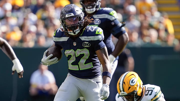 Aug 23, 2025; Green Bay, Wisconsin, USA;  Seattle Seahawks running back Damien Martinez (22) rushes wth the football during the second quarter against the Green Bay Packers at Lambeau Field.