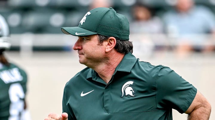 Michigan State's head coach Jonathan Smith jogs back to the sideline before the game against Youngstown State on Saturday, Sept. 13, 2025, at Spartan Stadium in East Lansing.