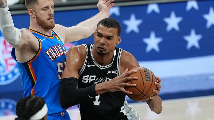 May 22, 2026; San Antonio, Texas, USA; San Antonio Spurs forward Victor Wembanyama (1) dribbles the ball past Oklahoma City Thunder center Isaiah Hartenstein (55) in the second half during game three of the western conference finals for the 2026 NBA playoffs at Frost Bank Center. Mandatory Credit: Daniel Dunn-Imagn Images May 22, 2026; San Antonio, Texas, USA; San Antonio Spurs forward Victor Wembanyama (1) dribbles the ball past Oklahoma City Thunder center Isaiah Hartenstein (55) in the second half during game three of the western conference finals for the 2026 NBA playoffs at Frost Bank Center. Mandatory Credit: Daniel Dunn-Imagn Images