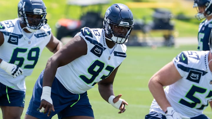 Jun 11, 2025; Renton, WA, USA; Seattle Seahawks defensive lineman Anthony Campbell (93) defensive lineman Bubba Thomas (69) and linebacker Connor O'Toole (57) take part in drills during mini-camp at Virginia Mason Athletic Center.