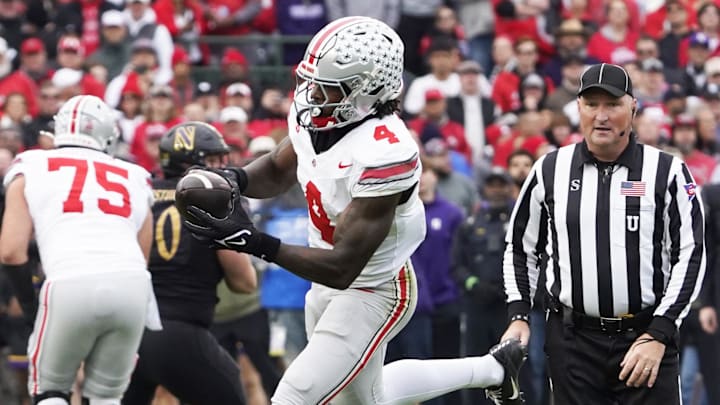 Nov 16, 2024; Chicago, Illinois, USA; Ohio State Buckeyes wide receiver Jeremiah Smith (4) runs the ball against the Northwestern Wildcats during the first half at Wrigley Field. Mandatory Credit: David Banks-Imagn Images Nov 16, 2024; Chicago, Illinois, USA; Ohio State Buckeyes wide receiver Jeremiah Smith (4) runs the ball against the Northwestern Wildcats during the first half at Wrigley Field. Mandatory Credit: David Banks-Imagn Images