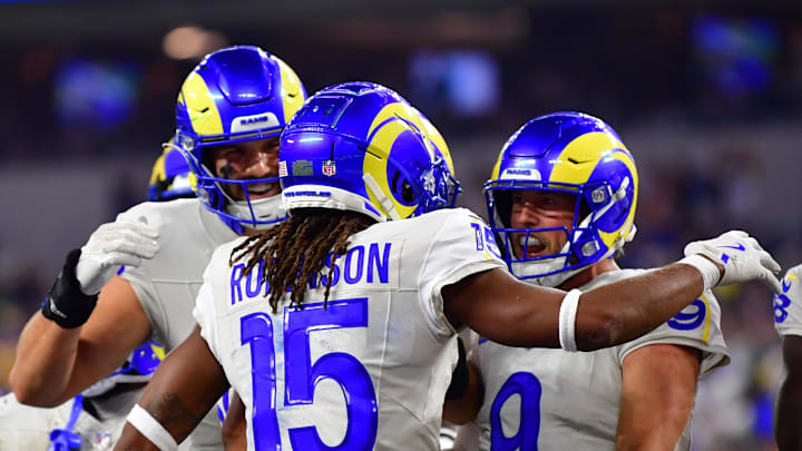 Oct 24, 2024; Inglewood, California, USA;  Los Angeles Rams wide receiver Demarcus Robinson (15) celebrates his touchdown scored against the against the Minnesota Vikings with quarterback Matthew Stafford (9) during the second half at SoFi Stadium. Mandatory Credit: Gary A. Vasquez-Imagn Images