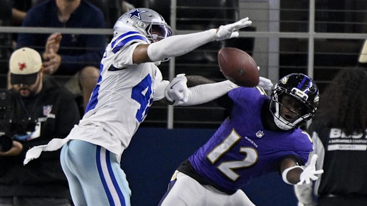 Aug 16, 2025; Arlington, Texas, USA; Dallas Cowboys cornerback Zion Childress (48) breaks up a pass intended for Baltimore Ravens wide receiver Malik Cunningham (12) during the second half at AT&T Stadium. Mandatory Credit: Jerome Miron-Imagn Images