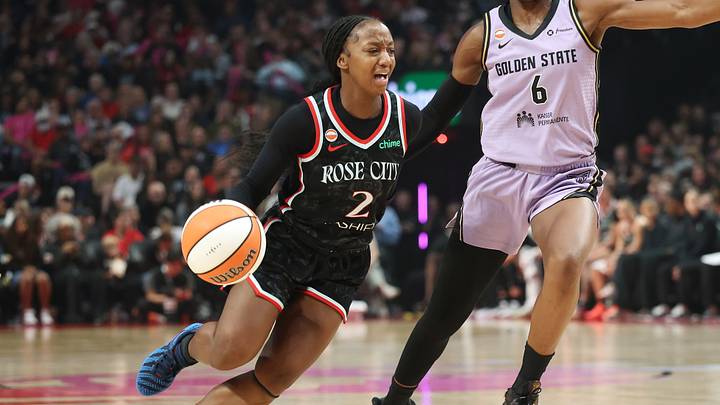 Sep 22, 2026; Portland, Oregon, USA;  Portland Fire guard Jordan Harrison (2) drives to the basket past Golden State Valkyries guard Kaila Charles (6) during the first half at Moda Center.  Mandatory Credit: Jaime Valdez-Imagn Images