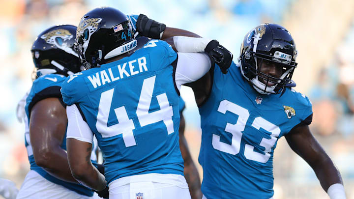 Jacksonville Jaguars linebacker Travon Walker (44) greets linebacker Devin Lloyd (33) before the game of a preseason matchup Saturday, Aug. 26, 2023 at EverBank Stadium in Jacksonville, Fla. [Corey Perrine/Florida Times-Union]