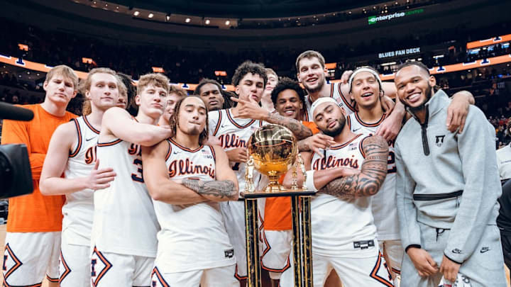 The Illinois basketball team gathers around the Braggin' Rights trophy, awarded to the winner of the annual rivalry game with Missouri, which the Illini earned in Sunday's 80-77 win over the Tigers in St. Louis.