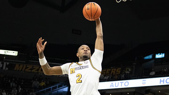 Dec. 3, 2024; Columbia, Mo. USA; Missouri Tigers guard Tamar Bates (2) leaps up for a dunk during a game against the California Golden Bears at Mizzou Arena.