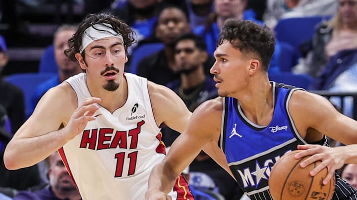 Orlando Magic forward Tristan da Silva drives past Miami Heat forward Jaime Jaquez Jr.