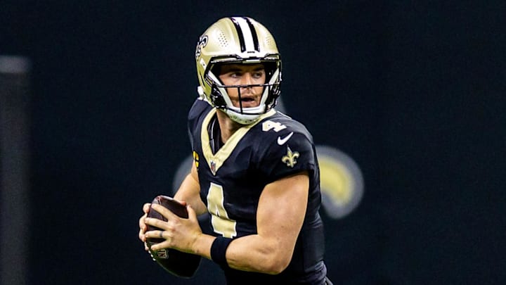 Nov 17, 2024; New Orleans, Louisiana, USA;  New Orleans Saints quarterback Derek Carr (4) rolls out the pocket against the Cleveland Browns during the first half at Caesars Superdome. Mandatory Credit: Stephen Lew-Imagn Images