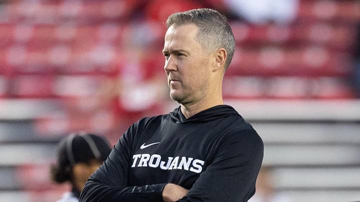 Oct 24, 2026; Madison, Wisconsin, USA; USC Trojans head coach Lincoln Riley watches his team during warmups before the game against the Wisconsin Badgers at Camp Randall Stadium. Oct 24, 2026; Madison, Wisconsin, USA; USC Trojans head coach Lincoln Riley watches his team during warmups before the game against the Wisconsin Badgers at Camp Randall Stadium.