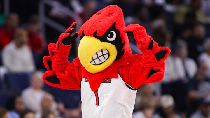 Mar 7, 2026; Duluth, GA, USA; Louisville Cardinals mascot Louie on the court against the North Carolina Tar Heels in the second quarter at Gas South Arena. Mandatory Credit: Brett Davis-Imagn Images