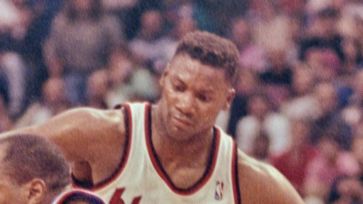 Pistons' Vinnie Johnson with the ball guarded by Trail Blazers' Jerome Kersey. Pistons' Vinnie Johnson with the ball guarded by Trail Blazers' Jerome Kersey.