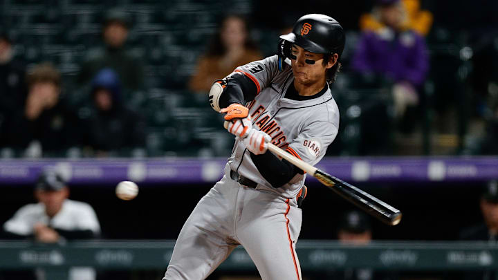 May 7, 2024; Denver, Colorado, USA; San Francisco Giants center fielder Jung Hoo Lee (51) hits a single in the eighth inning against the Colorado Rockies at Coors Field. =