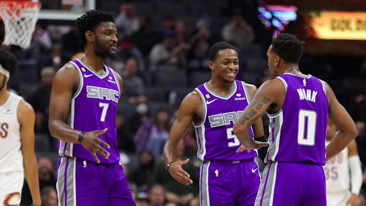 Nov 9, 2022; Sacramento, California, USA; Sacramento Kings guard Malik Monk (0) celebrates with guard De'Aaron Fox (5) and forward Chimezie Metu (7) after making a basket during the second quarter against the Cleveland Cavaliers at Golden 1 Center. Mandatory Credit: Sergio Estrada-Imagn Images