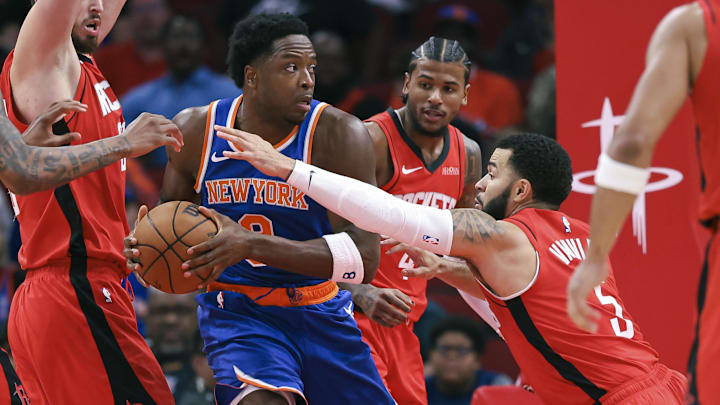 New York Knicks forward OG Anunoby (8) attempts to control the ball as Houston Rockets guard Fred VanVleet (5) defends during the first quarter at Toyota Center.