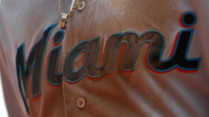A view of the logo on the chest of the jersey of a Miami Marlins player. 