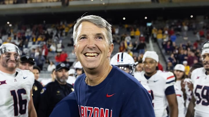 Nov 28, 2025; Tempe, Arizona, USA; Arizona Wildcats head coach Brent Brennan celebrates against the Arizona State Sun Devils during the 99th Territorial Cup at Mountain America Stadium. Mandatory Credit: Mark J. Rebilas-Imagn Images