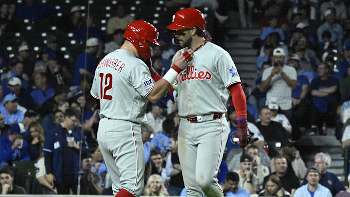 Apr 21, 2026; Chicago, Illinois, USA;  Philadelphia Phillies first baseman Bryce Harper (3) celebrates with left fielder Kyle Schwarber (12) after hitting a two-run home run against the Chicago Cubs during the seventh inning at Wrigley Field.