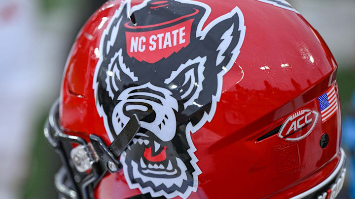 Nov 11, 2023; Winston-Salem, North Carolina, USA; The North Carolina State Wolfpack helmet rests on the bench during the second half against the Wake Forest Demon Deacons at Allegacy Federal Credit Union Stadium. Mandatory Credit: William Howard-Imagn Images