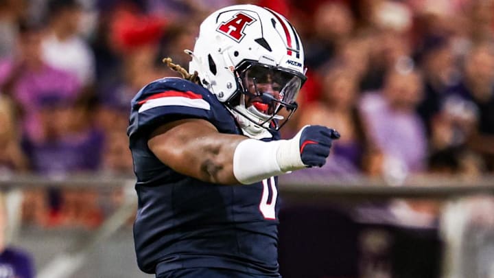 Sep 12, 2025; Tucson, Arizona, USA; Arizona Wildcats defensive lineman Deshawn McKnight (0) celebrates after he tackles the Kansas State Wildcats during the third quarter of the game at Arizona Stadium. Mandatory Credit: Aryanna Frank-Imagn Images