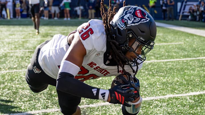 Oct 11, 2025; South Bend, Indiana, USA; NC State Wolfpack defensive back Asaad Brown Jr. (26) intercepts a pass in the end zone against the Notre Dame Fighting Irish during the first half at Notre Dame Stadium. Mandatory Credit: Michael Caterina-Imagn Images Oct 11, 2025; South Bend, Indiana, USA; NC State Wolfpack defensive back Asaad Brown Jr. (26) intercepts a pass in the end zone against the Notre Dame Fighting Irish during the first half at Notre Dame Stadium. Mandatory Credit: Michael Caterina-Imagn Images