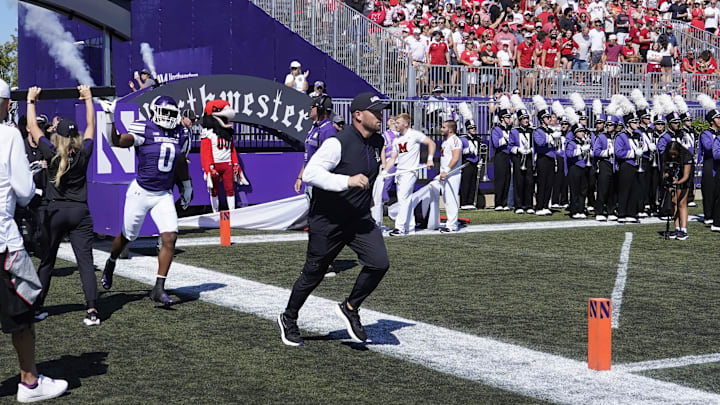 Aug 31, 2024; Evanston, Illinois, USA; Northwestern Wildcats head coach David Braun takes the field with his team against the Miami (Oh) Redhawks at Lanny and Sharon Martin Stadium. Mandatory Credit: David Banks-Imagn Images Aug 31, 2024; Evanston, Illinois, USA; Northwestern Wildcats head coach David Braun takes the field with his team against the Miami (Oh) Redhawks at Lanny and Sharon Martin Stadium. Mandatory Credit: David Banks-Imagn Images