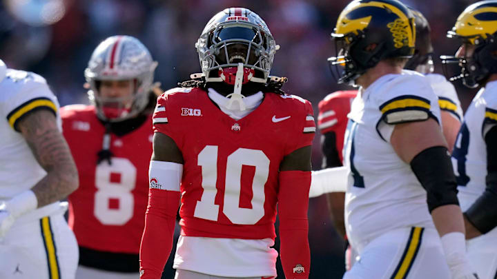 Ohio State Buckeyes cornerback Denzel Burke (10) celebrates after at tackle against Michigan Wolverines during the first quarter of the NCAA football game at Ohio Stadium in Columbus on Saturday, Nov. 30, 2024.