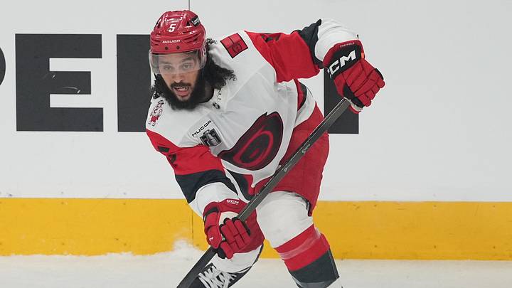 Jun 14, 2026; Las Vegas, Nevada, USA; Carolina Hurricanes defenseman Jalen Chatfield (5) controls the puck during the first period against the Vegas Golden Knights in game six of the 2026 Stanley Cup Final at T-Mobile Arena. Mandatory Credit: Lucas Peltier-Imagn Images
