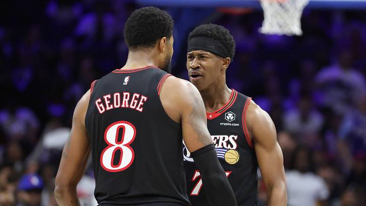 Philadelphia 76ers guard Vj Edgecombe (77) reacts after a forward Paul George (8) score against the Orlando Magic during the third quarter of a play-in round of the 2026 NBA Playoffs at Xfinity Mobile Arena.