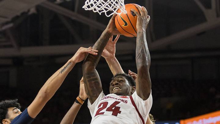 Arkansas Razorbacks guard Billy Richmond III (24) gets a rebound in front of Gonzaga Bulldogs forward Izan Almansa (13) during the second half at Bud Walton Arena. 