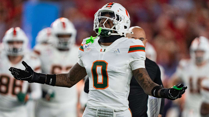 Miami Hurricanes defensive back Keionte Scott runs onto the field at the start of the CFP Fiesta Bowl.