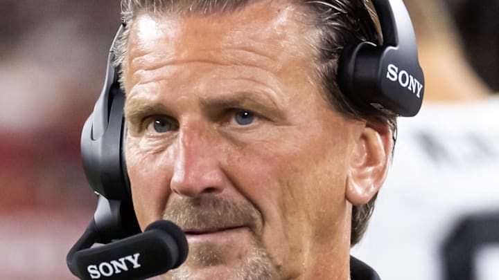 Aug 23, 2025; Glendale, Arizona, USA; Las Vegas Raiders quarterbacks coach Greg Olson against the Arizona Cardinals during a preseason NFL game at State Farm Stadium. Mandatory Credit: Mark J. Rebilas-Imagn Images