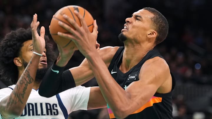 Apr 10, 2026; San Antonio, Texas, USA; San Antonio Spurs forward Victor Wembanyama (1) drives to the basket against Dallas Mavericks forward Marvin Bagley, Jr. (35) during the first half at Frost Bank Center. Mandatory Credit: Scott Wachter-Imagn Images