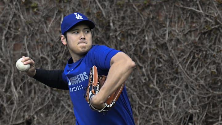 Apr 23, 2025; Chicago, Illinois, USA; Los Angeles Dodgers two-way player Shohei Ohtani (17) warms up before the teams game against the Chicago Cubs at Wrigley Field. Apr 23, 2025; Chicago, Illinois, USA; Los Angeles Dodgers two-way player Shohei Ohtani (17) warms up before the teams game against the Chicago Cubs at Wrigley Field.