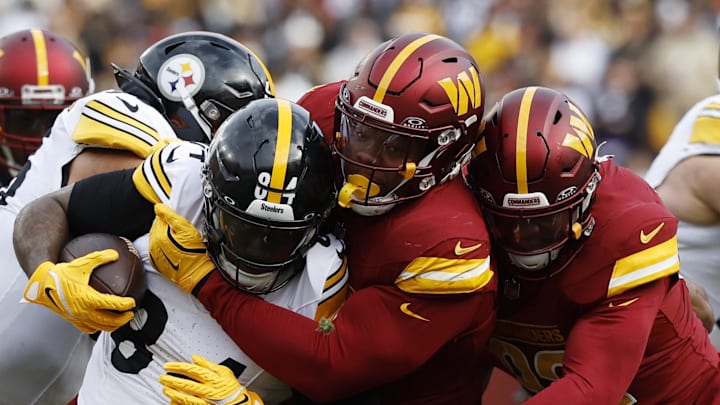 Nov 10, 2024; Landover, Maryland, USA;  Pittsburgh Steelers running back Cordarrelle Patterson (84) is tackled by Washington Commanders defensive tackle Daron Payne (94) during the first half at Northwest Stadium. Mandatory Credit: Geoff Burke-Imagn Images