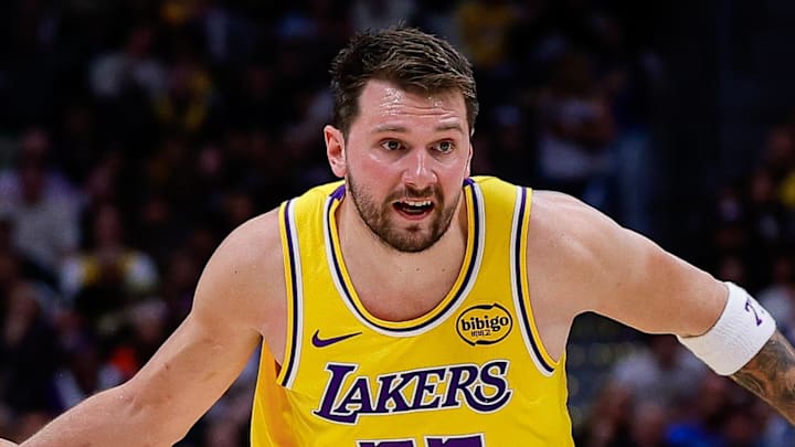 Mar 5, 2026; Denver, Colorado, USA; Los Angeles Lakers guard Luka Doncic (77) controls the ball as Denver Nuggets guard Christian Braun (0) guards in the third quarter at Ball Arena. Mandatory Credit: Isaiah J. Downing-Imagn Images Mar 5, 2026; Denver, Colorado, USA; Los Angeles Lakers guard Luka Doncic (77) controls the ball as Denver Nuggets guard Christian Braun (0) guards in the third quarter at Ball Arena. Mandatory Credit: Isaiah J. Downing-Imagn Images
