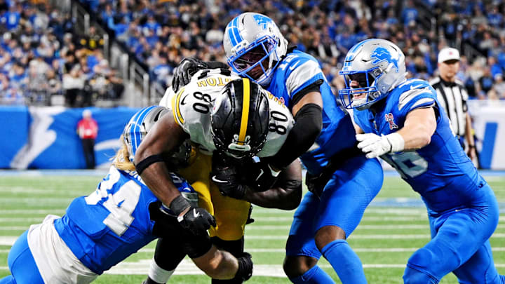 Pittsburgh Steelers tight end Darnell Washington (80) runs the ball against Detroit Lions linebacker Alex Anzalone (34) Pittsburgh Steelers tight end Darnell Washington (80) runs the ball against Detroit Lions linebacker Alex Anzalone (34)