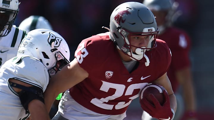 Aug 31, 2024; Pullman, Washington, USA; Washington State Cougars tight end Trey Leckner (23) carries the ball against Portland State Vikings defensive back Zach Wusstig (3) in the second half at Gesa Field at Martin Stadium. Mandatory Credit: James Snook-USA TODAY Sports
